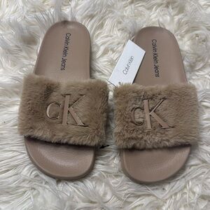 Brand new Calvin Klein fur slides size 8